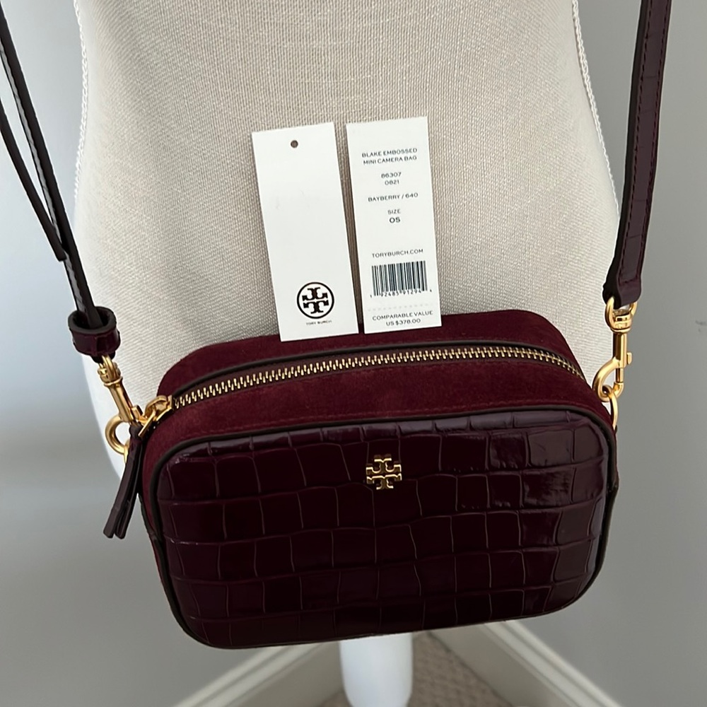 Tory Burch camera bag, leather and suede with brushed gold hardware.